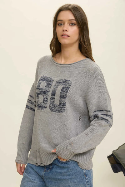 DISTRESSED LONG SLEEVE VARSITY KNIT SWEATER