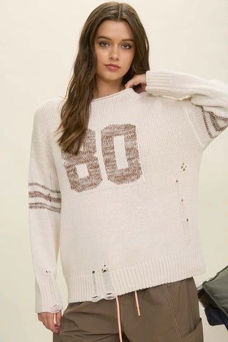 DISTRESSED LONG SLEEVE VARSITY KNIT SWEATER